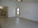 Spacious main bedroom with tile flooring, ceiling fan, and ensuite bath with separate vanity at 2235 Emperor Dr, Kissimmee, FL 34744