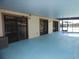 Covered pool area featuring a blue deck, screened enclosure, and access to the home at 2235 Emperor Dr, Kissimmee, FL 34744
