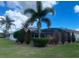 Private backyard featuring a screened-in pool, lush landscaping, and plenty of space for entertainment at 24 Cordona Dr, Kissimmee, FL 34758
