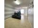Versatile bonus room featuring recliner chairs, neutral tile flooring, and neutral paint palette at 24 Cordona Dr, Kissimmee, FL 34758
