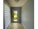 Bright entryway featuring neutral paint, tile flooring, and a window with view to the outdoors at 24 Cordona Dr, Kissimmee, FL 34758