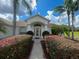 Inviting front entrance with lush landscaping, creating a warm and welcoming path to the home's front door at 24 Cordona Dr, Kissimmee, FL 34758