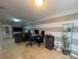 Spacious living room with tile floors, a tv and desk area provides comfort and style at 24 Cordona Dr, Kissimmee, FL 34758