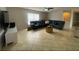 Spacious living room features a large sectional sofa, neutral color palette, and large window at 24 Cordona Dr, Kissimmee, FL 34758