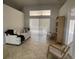 Cozy living room featuring high ceilings, tile floors, and sliding doors leading to the outdoors at 24 Cordona Dr, Kissimmee, FL 34758