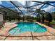 Inviting pool with a screened-in enclosure, providing a serene and private outdoor space for relaxation at 24 Cordona Dr, Kissimmee, FL 34758