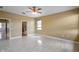 Bedroom with tile floors, neutral walls, bright natural light and a ceiling fan at 2412 Country Pond Ct, St Cloud, FL 34771