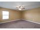 Bedroom with a ceiling fan, neutral paint, carpet, and natural light from a window at 2412 Country Pond Ct, St Cloud, FL 34771