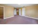 Neutral bedroom showcasing soft carpet, an open closet, and a mirror at 2412 Country Pond Ct, St Cloud, FL 34771