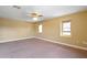 Large bedroom featuring neutral walls, carpet, and a ceiling fan at 2412 Country Pond Ct, St Cloud, FL 34771