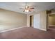 Bedroom featuring a ceiling fan, closet, neutral paint, and carpet at 2412 Country Pond Ct, St Cloud, FL 34771