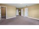 A spacious bedroom has neutral walls with closet access at 2412 Country Pond Ct, St Cloud, FL 34771