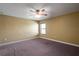 Bedroom with neutral paint, ceiling fan, carpet, and a window at 2412 Country Pond Ct, St Cloud, FL 34771