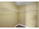 Walk-in closet with wire shelving and carpet at 2412 Country Pond Ct, St Cloud, FL 34771