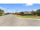 View of the Blackstone community entrance with an American flag and manicured landscaping at 2412 Country Pond Ct, St Cloud, FL 34771