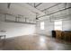 Garage featuring overhead storage, concrete floor, and a utility sink at 2412 Country Pond Ct, St Cloud, FL 34771