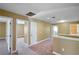 Carpeted upstairs hallway with multiple doorways and recessed lighting at 2412 Country Pond Ct, St Cloud, FL 34771
