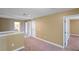 Carpeted upstairs hallway featuring entryways to multiple rooms at 2412 Country Pond Ct, St Cloud, FL 34771