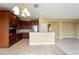 Open-concept kitchen with dark cabinetry, granite countertops, and stainless steel appliances at 2412 Country Pond Ct, St Cloud, FL 34771