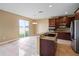 Modern kitchen with stainless steel appliances and convenient breakfast bar area at 2412 Country Pond Ct, St Cloud, FL 34771