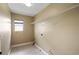 The laundry room has tile flooring and a window for natural light at 2412 Country Pond Ct, St Cloud, FL 34771