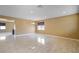Expansive living room area with tile flooring and abundant natural light at 2412 Country Pond Ct, St Cloud, FL 34771