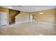 Inviting living room area featuring tile floors and staircase access at 2412 Country Pond Ct, St Cloud, FL 34771