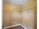 A walk-in closet with wire shelving and neutral-colored walls provides ample storage space at 2412 Country Pond Ct, St Cloud, FL 34771