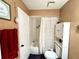 Functional bathroom featuring a toilet, a shower-tub combo, and a vanity sink, plus modern white cabinet at 268 Florida Pkwy, Kissimmee, FL 34743