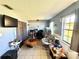 Comfortable living room with tile floors and a large window, plus an adjacent office nook at 268 Florida Pkwy, Kissimmee, FL 34743