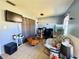 Cozy living room features tile floors, tv, and a unique wood coffee table at 268 Florida Pkwy, Kissimmee, FL 34743