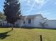 Side view of house with well-maintained lawn and privacy fence at 268 Florida Pkwy, Kissimmee, FL 34743