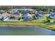 Aerial view showing a pool home with a screened enclosure in a lush backyard setting at 3686 Ricky Ln, St Cloud, FL 34772