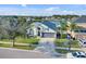 Aerial shot of a single-story home with a view of a serene lake at 3686 Ricky Ln, St Cloud, FL 34772