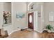 Bright entryway with hard wood floors, arched doorway, and decor at 3686 Ricky Ln, St Cloud, FL 34772
