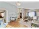 Open living room with vaulted ceiling, a hardwood floor, and modern furnishings at 3686 Ricky Ln, St Cloud, FL 34772