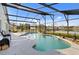 Backyard oasis featuring a screened-in pool, comfortable lounge seating, and tranquil lake views at 3686 Ricky Ln, St Cloud, FL 34772