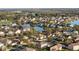 A beautiful aerial view of a neighborhood with winding streets, ponds, and lush landscaping surrounding the lovely homes at 4301 Presidio Way, Kissimmee, FL 34746