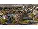 An aerial view of the residential neighborhood displaying well-maintained homes with mature trees along the streets at 4301 Presidio Way, Kissimmee, FL 34746