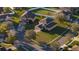 Aerial image of a residential home with mature landscaping, brick driveway, and manicured lawn at 4301 Presidio Way, Kissimmee, FL 34746