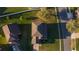 Birds eye view of neighborhood house with attached garage and beautiful landscape at 4301 Presidio Way, Kissimmee, FL 34746