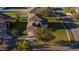 Aerial image showing a two-story home with a brick driveway, well-kept lawn, and attractive landscaping in a suburban neighborhood at 4301 Presidio Way, Kissimmee, FL 34746