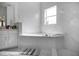 Marble bathroom features a soaking tub, large window, and bright interior at 4301 Presidio Way, Kissimmee, FL 34746