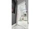 Bright bathroom features marble tile floors and walls plus a modern vanity and fixtures at 4301 Presidio Way, Kissimmee, FL 34746
