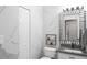 Bathroom featuring marble tile and a stylish, vertically mirrored vanity at 4301 Presidio Way, Kissimmee, FL 34746