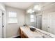 Bathroom features a double vanity with a large mirror and neutral color palette at 4301 Presidio Way, Kissimmee, FL 34746