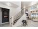 Elegant entryway featuring modern staircase, marble floors, and open concept design leading to living spaces at 4301 Presidio Way, Kissimmee, FL 34746