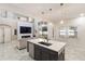 Stylish kitchen with island, stainless steel appliances, marble floors, and pendant lighting at 4301 Presidio Way, Kissimmee, FL 34746
