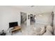 Open living space with marble flooring and access to the stairway at 4301 Presidio Way, Kissimmee, FL 34746
