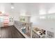 Upper level loft showcasing wrought iron railing, hardwood floors, and view of the floor below at 4301 Presidio Way, Kissimmee, FL 34746